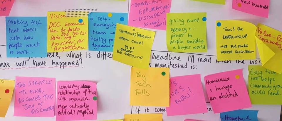 a flip chart with colourful postits with ideas about the future of DCC